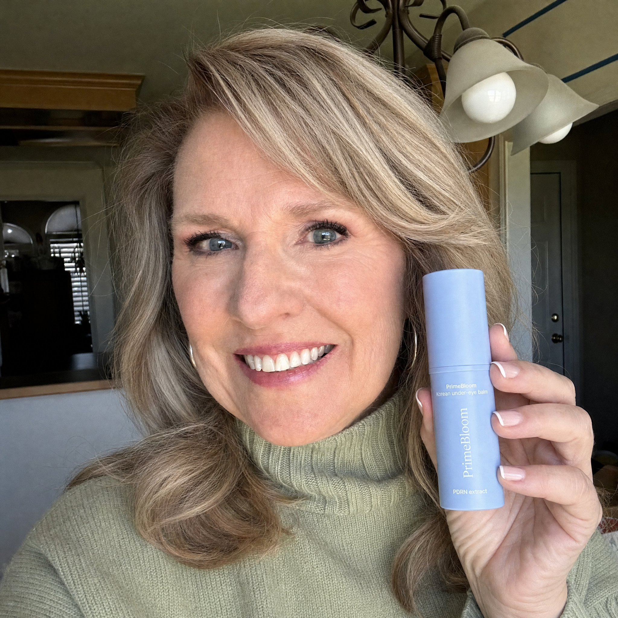 Woman holding PrimeBloom product