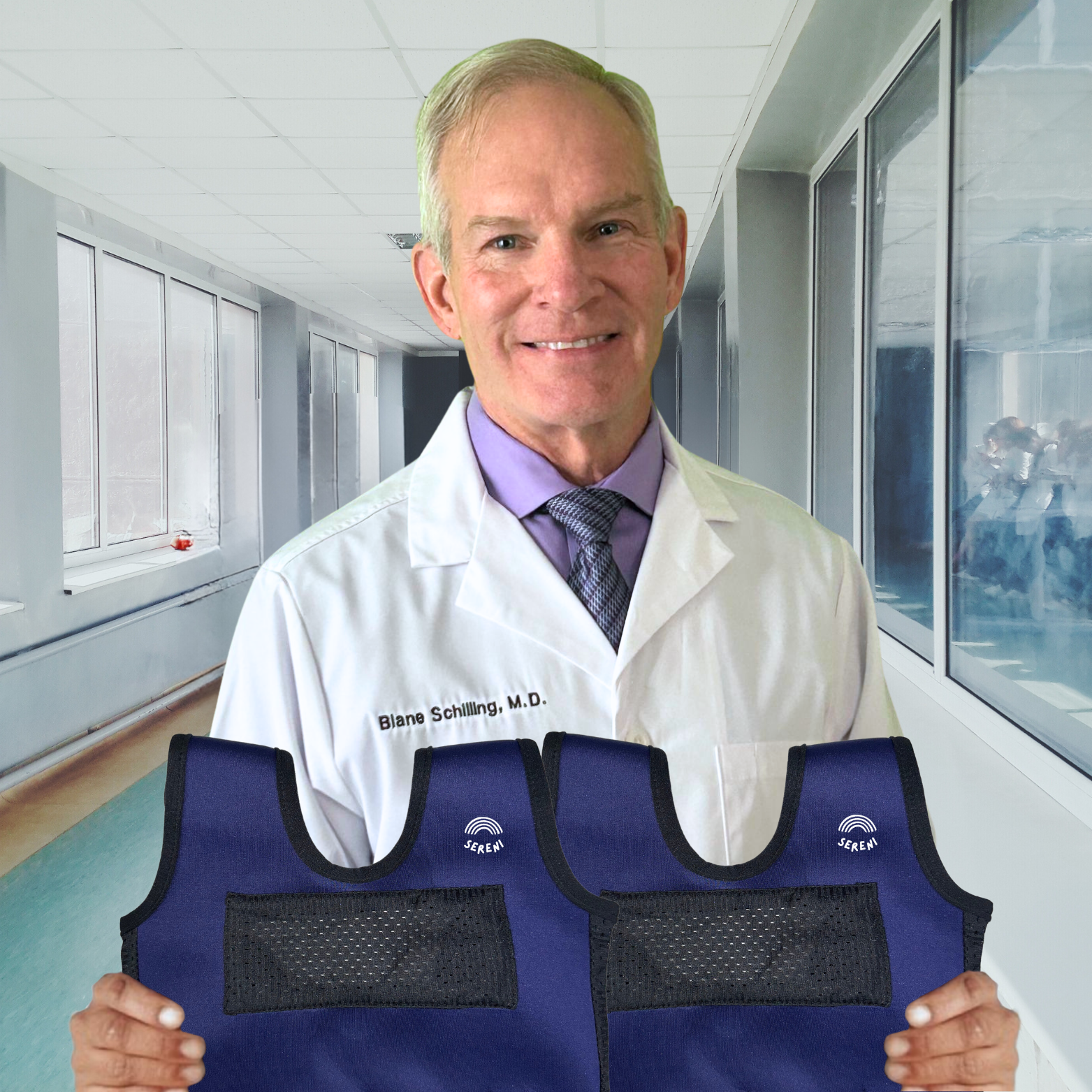 Doctor in a lab coat holding a blue protective vest in a hallway.