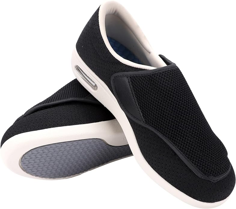 Black slip-on sneakers with white soles.